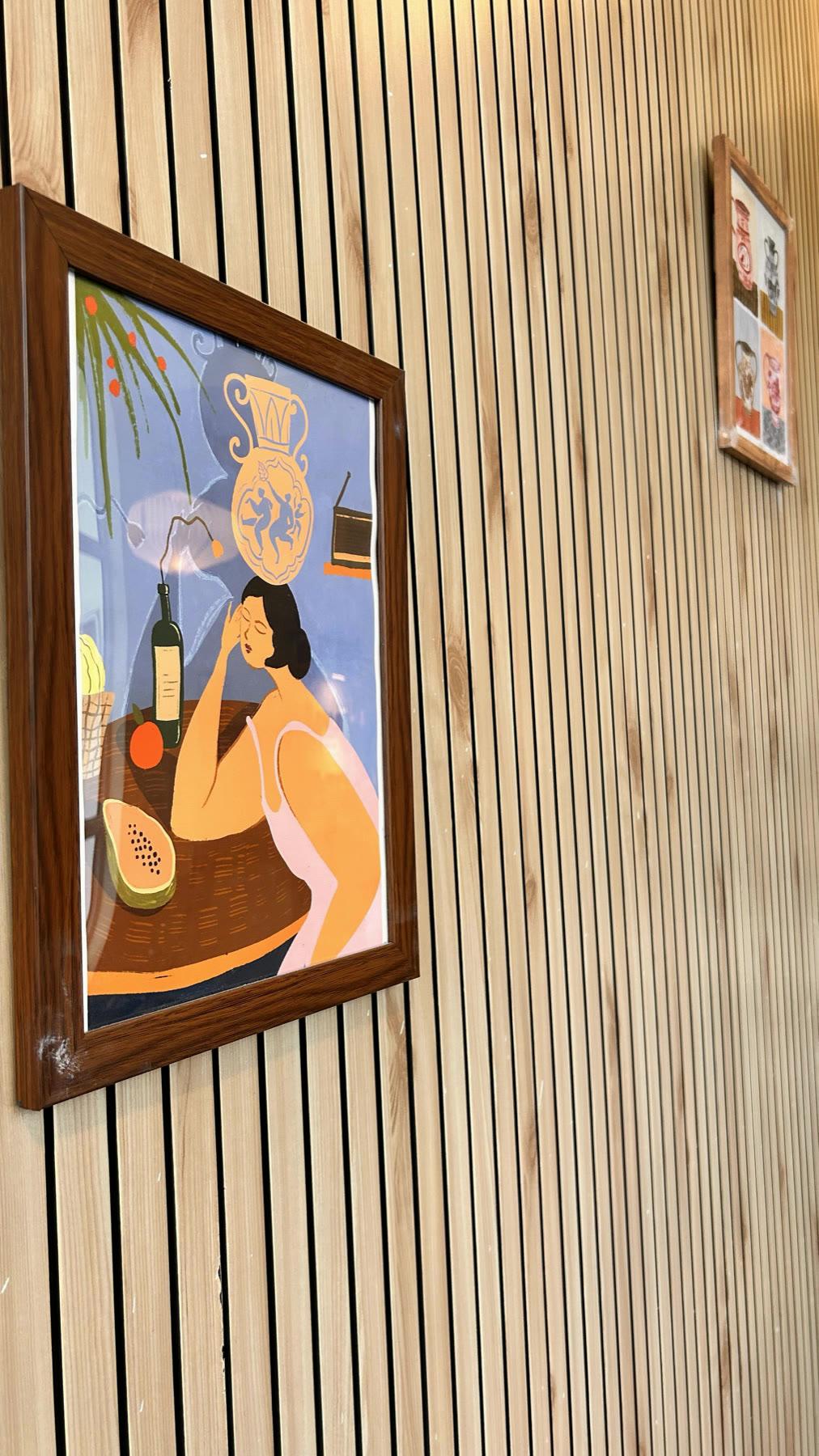 Finished pieces and hanging work along the studio wall