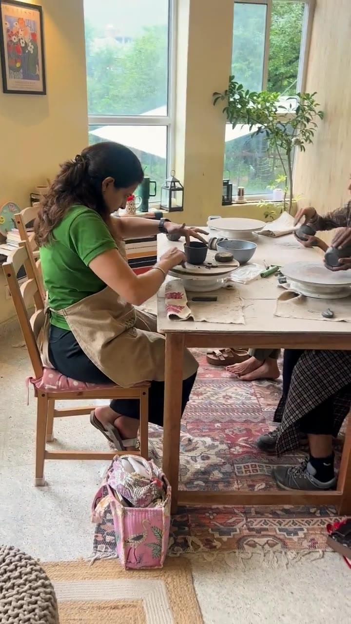 The long studio table with work in progress along it